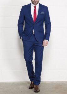 navy suit with brown shoes and red tie